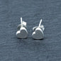 Small silver heart stud earrings with delicate plate design by Suzie Blue Canada, perfect for everyday wear.