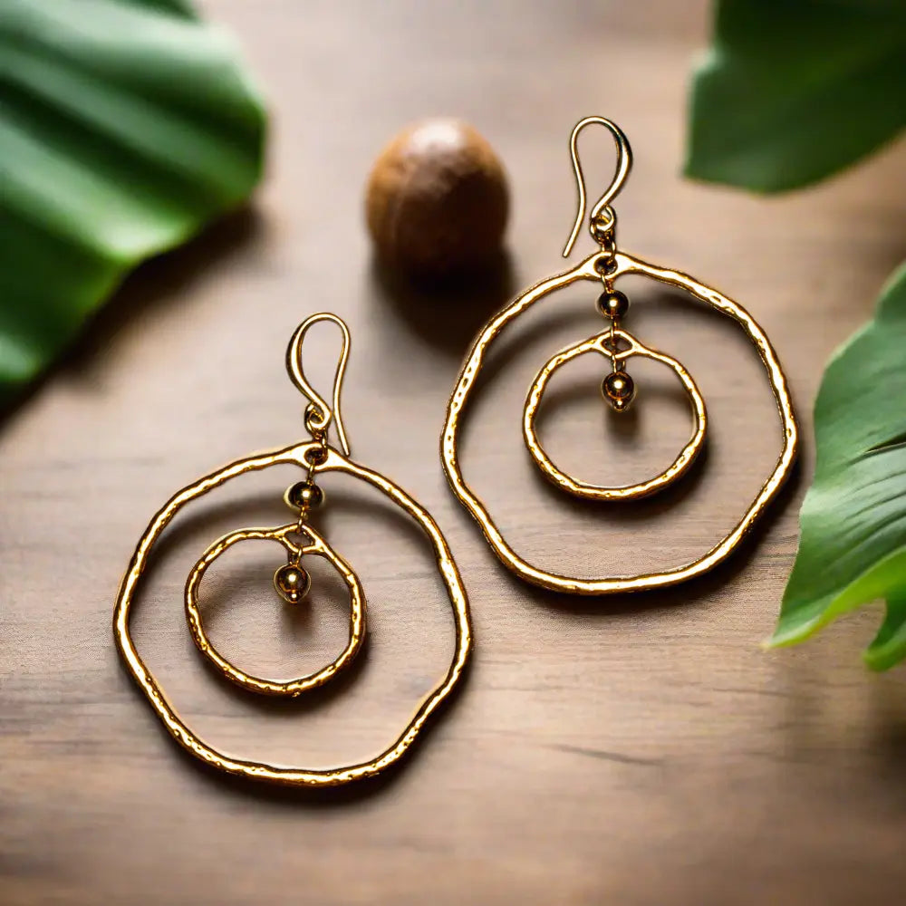 Gold plated beaten double ring earrings by Suzie Blue Canada featuring a textured, modern hoop design.