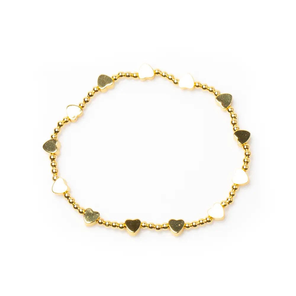 Gold heart bracelet with elasticated design featuring gold plating, showcasing elegant jewelry style by Suzie Blue Canada.