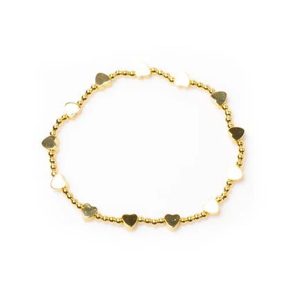 Gold heart bracelet with elasticated design featuring gold plating, showcasing elegant jewelry style by Suzie Blue Canada.