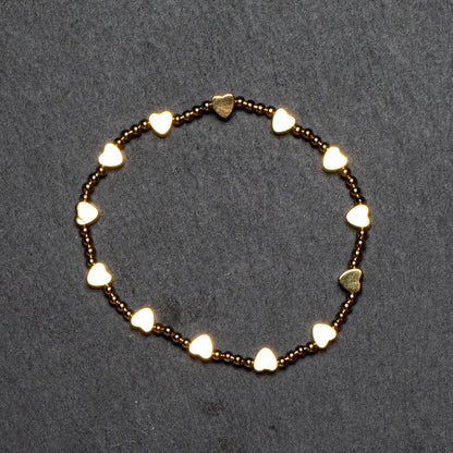 Elegant gold plated heart-shaped bracelet featuring elastic design, by Suzie Blue Canada, showcasing a stylish jewelry accessory.