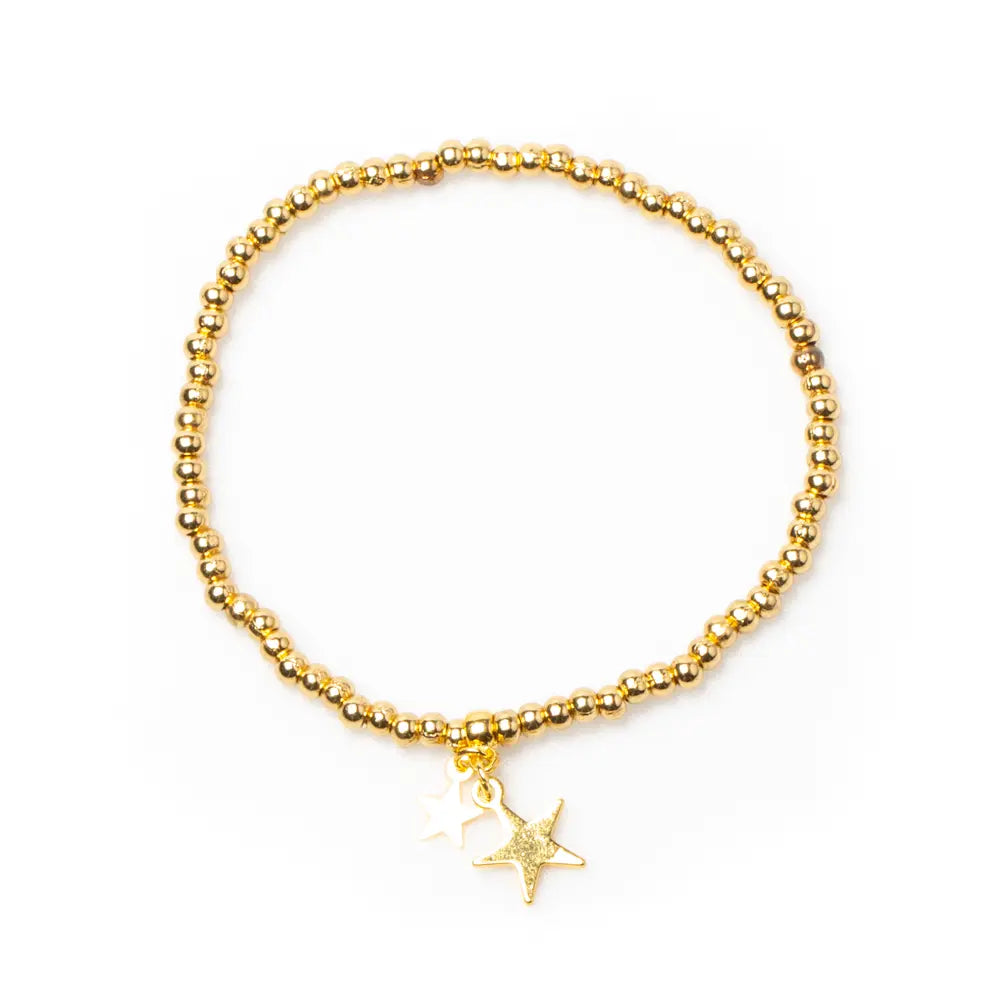 Gold star charm bracelet with elasticated design, gold plating, by Suzie Blue Canada, featuring a delicate star pendant.