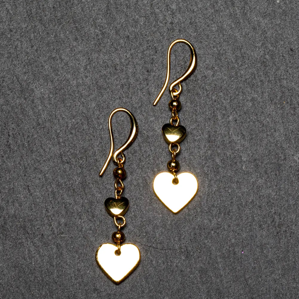 Gold-plated heart drop earrings by Suzie Blue Canada featuring elegant, dangling jewelry perfect for any occasion.