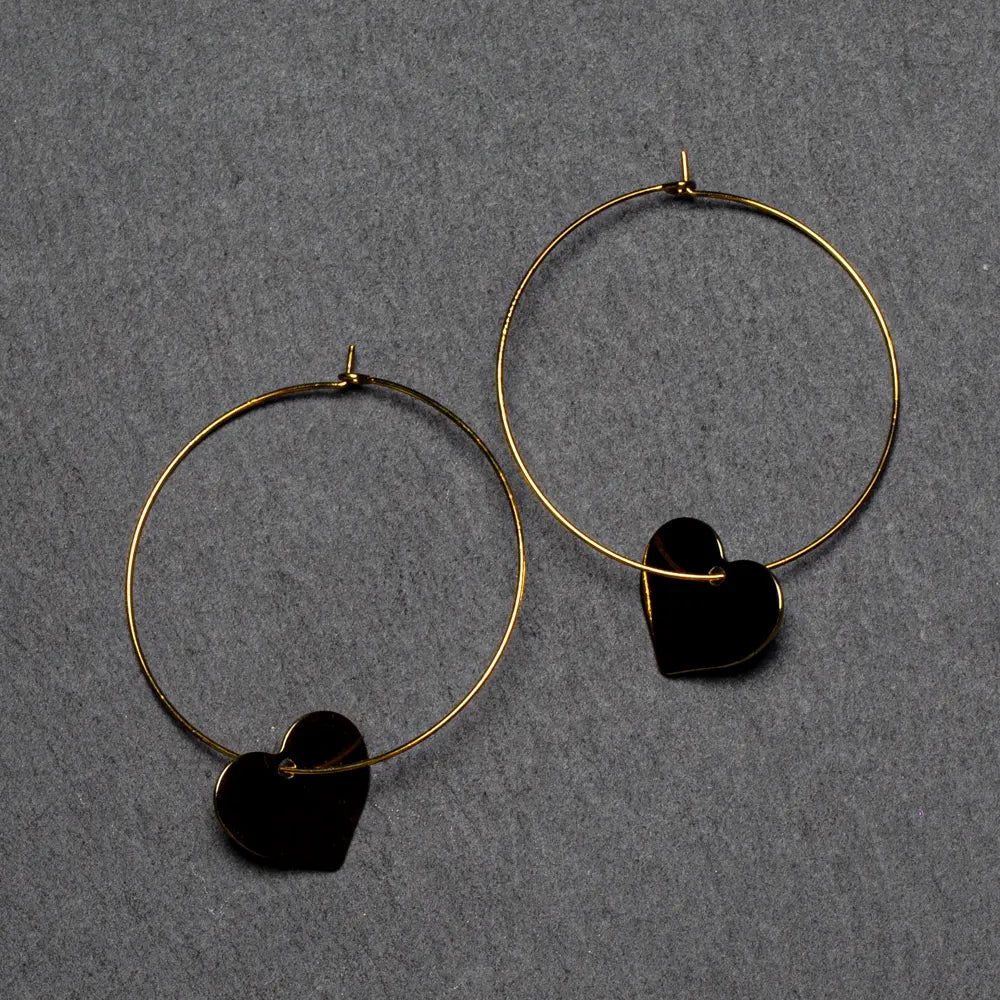 Gold plated heart on hoop earring by Suzie Blue Canada, stylish gold hoop with a heart-shaped charm for women.