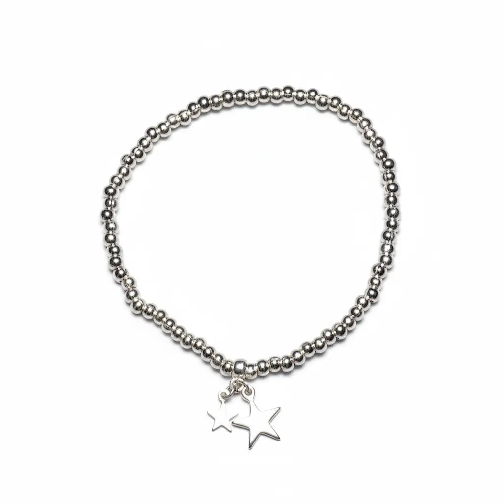 Silver star charm bracelet from Suzie Blue Canada featuring elegant silver jewelry with a charming star design.