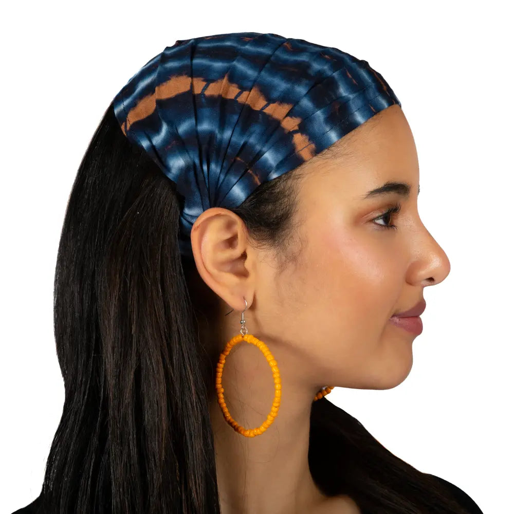 Blue and gold tie dye bandana hair accessory by Suzie Blue Canada featuring vibrant colors and stylish design.