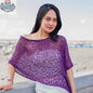 Purple knit poncho by Suzie Blue Canada featuring popcorn knit pattern, cozy and stylish short knitwear for layered warmth.