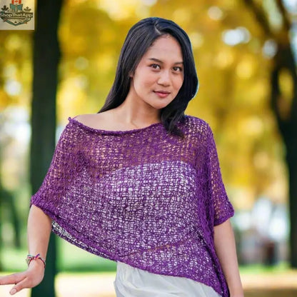 Purple popcorn knit poncho by Suzie Blue Canada, cozy and stylish knitwear with a textured popcorn pattern.