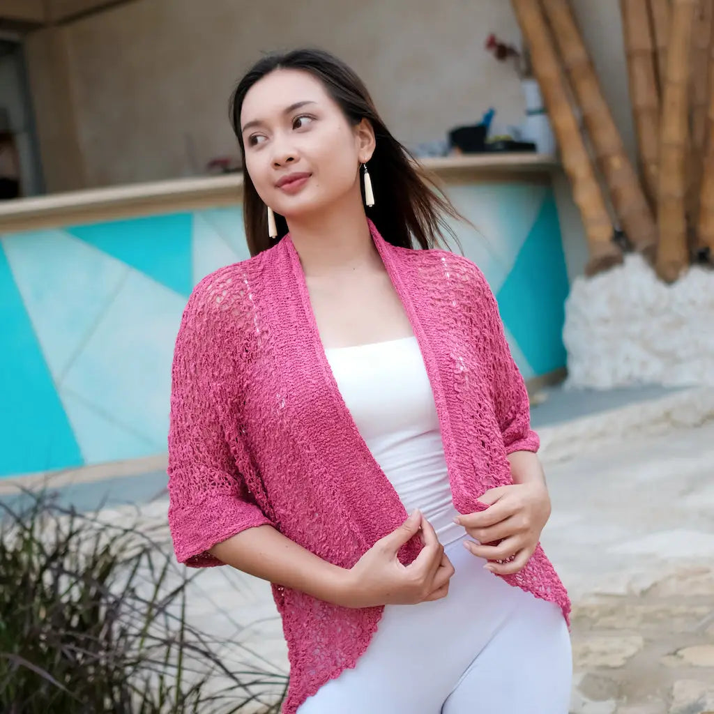 Pink short-sleeved knit cardigan by Suzie Blue Canada, stylish layering piece with a soft, textured fabric.