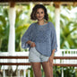 Suzie Blue Canada denim blue short-sleeved knit top, stylish and versatile, displayed on a neutral background.