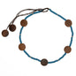 Long coconut bead necklace with wooden discs, featuring natural beige and brown tones, by Suzie Blue Canada.