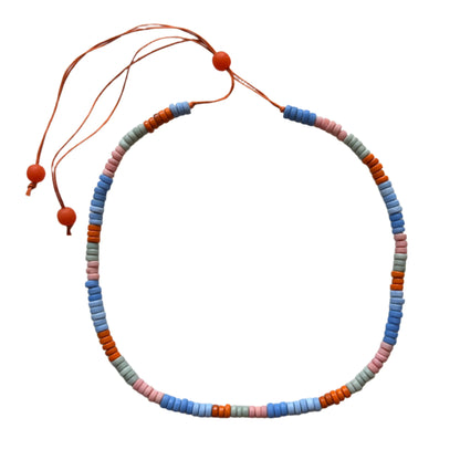Single strand glass bead necklace by Suzie Blue Canada featuring colorful, round glass beads on a delicate chain.