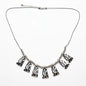 Silver plated Beaten Fan Necklace by Suzie Blue Canada featuring an elegant, textured fan-shaped pendant on a delicate chain.