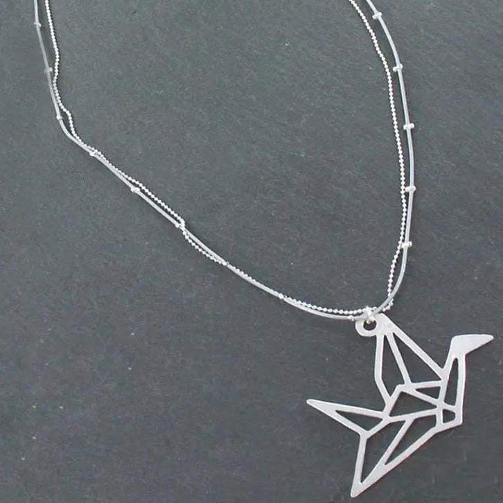 Silver plate double strand necklace with origami bird pendant by Suzie Blue Canada, featuring intricate bird design and layered chains.