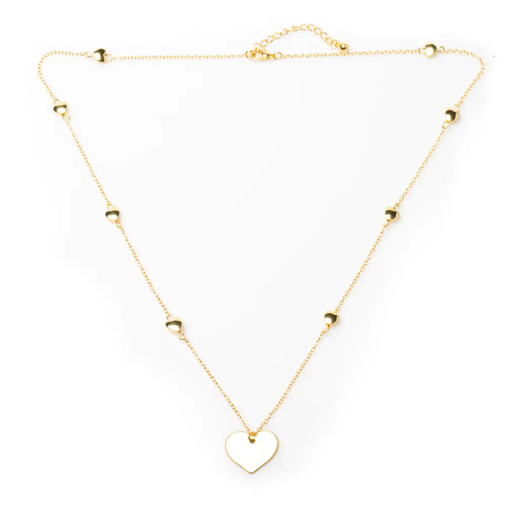 Gold-plated heart necklace with layered heart chain design by Suzie Blue Canada, featuring a delicate and stylish jewelry piece.