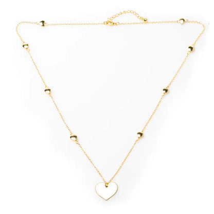 Gold-plated heart necklace with layered heart chain design by Suzie Blue Canada, featuring a delicate and stylish jewelry piece.