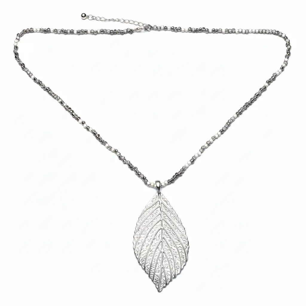 Silver leaf necklace on cube chain by Suzie Blue Canada, showcasing a delicate silver pendant with a sleek chain.