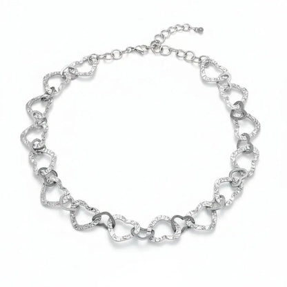 Grey stainless steel linked heart necklace from Suzie Blue Canada, showcasing a delicate chain with interconnected heart charms.