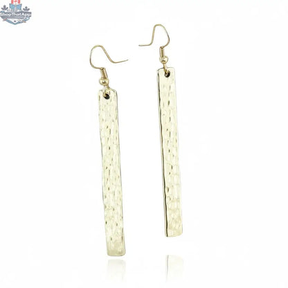 Gold metal bar earrings by Suzie Blue Canada, stylish and minimalist jewelry for every occasion, featuring sleek gold-toned design.