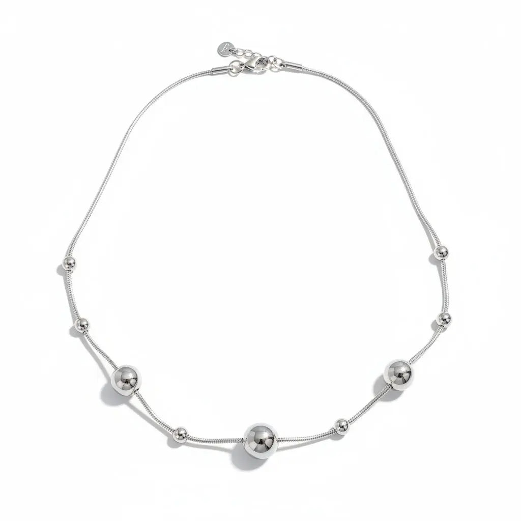 Grey stainless steel Multi Ball Necklace by Suzie Blue Canada featuring multiple spherical beads on a sleek chain.