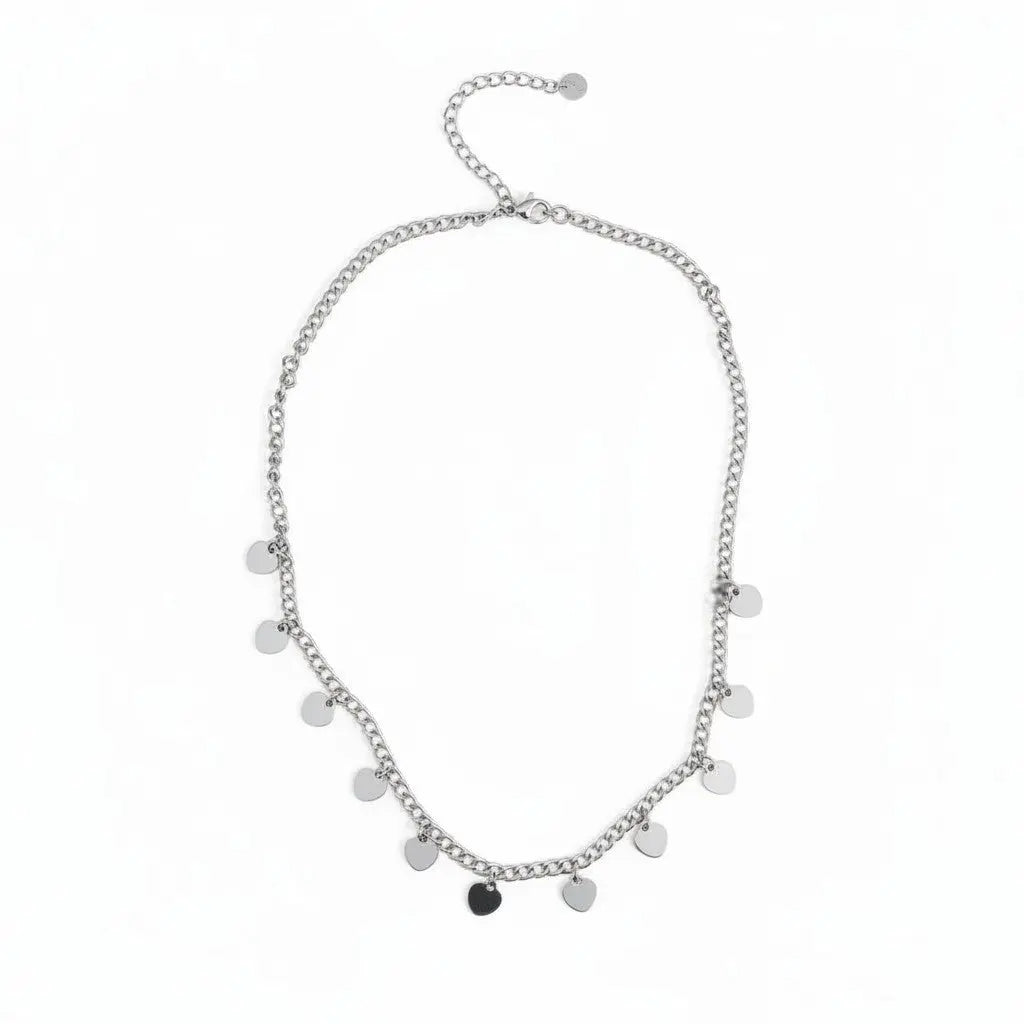 Silver stainless steel multi-heart charm necklace featuring layered heart pendants, designed by Suzie Blue Canada.