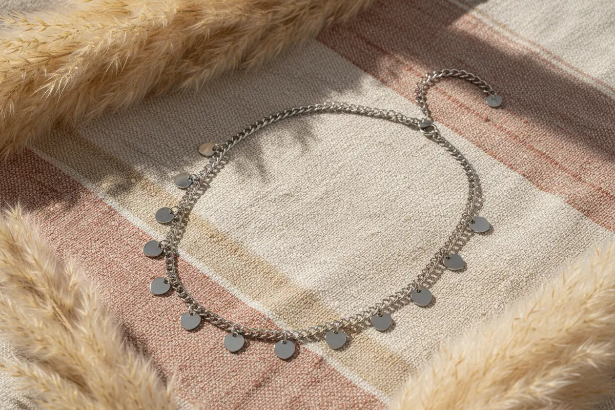 Silver stainless steel multi-heart charm necklace featuring layered hearts, designed by Suzie Blue Canada.