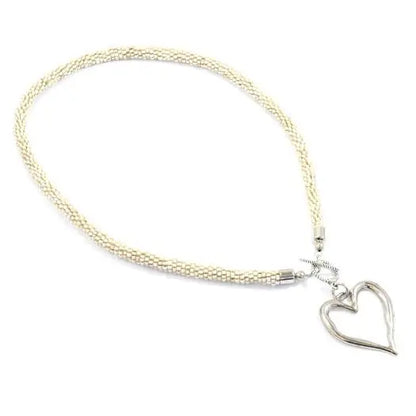 Short beaded heart necklace with open heart design by Suzie Blue Canada, featuring colorful beads and delicate craftsmanship.