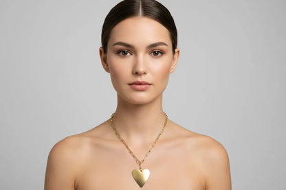 Gold stainless steel chainlink heart pendant necklace by Suzie Blue Canada, featuring a delicate heart design for her.