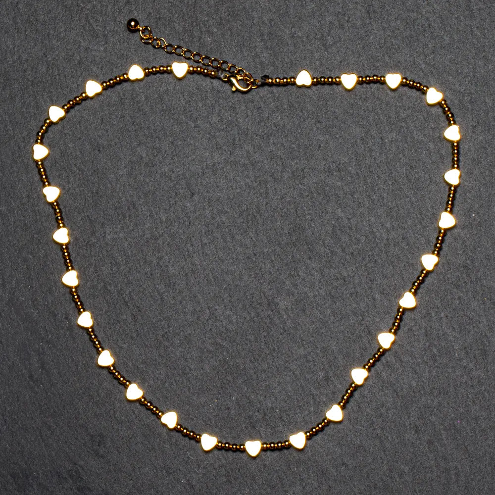 Gold-plated short heart necklace by Suzie Blue Canada featuring a delicate pendant for elegant style.