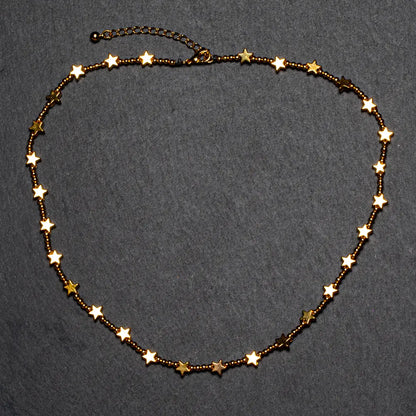 Gold plated short star necklace by Suzie Blue Canada featuring a delicate star pendant for elegant everyday wear