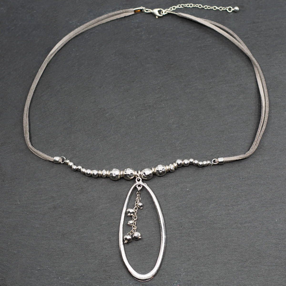 Silver beaded pendant necklace with suede strap and oval silver plate, stylish jewelry by Suzie Blue Canada