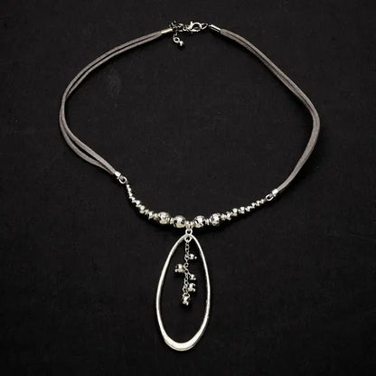 Silver beaded pendant necklace with oval silver plate on a suede strap, by Suzie Blue Canada.
