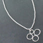 Silver bubble pendant necklace on a silver ball chain, featuring a shiny, round silver pendant from Suzie Blue Canada.
