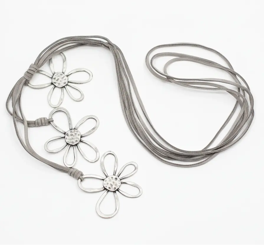Silver flower necklace with three detailed flower charms on suede cord, by Suzie Blue Canada.
