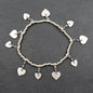 Silver heart charm bracelet with elasticated design, featuring a delicate chain and heart pendant, by Suzie Blue Canada.