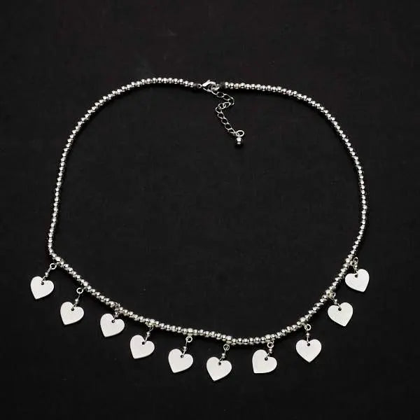 Silver plate charm necklace by Suzie Blue Canada featuring drop heart pendants in an elegant short design.