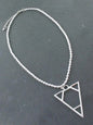 Silver ball pendant necklace with tear drop tassel earrings, elegant jewelry set by Suzie Blue Canada, perfect for stylish occasions.