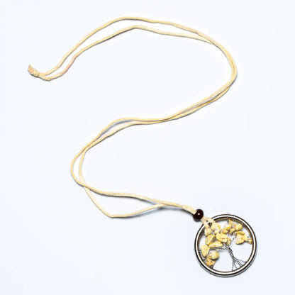 Suzie Blue Canada Tree of Life necklace featuring a natural stone pendant on a silver chain, showcasing intricate design and earthy tones.