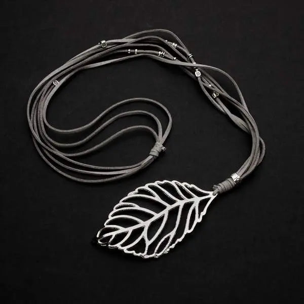 Silver-plated suede necklace featuring a leaf pendant, stylish jewelry piece by Suzie Blue Canada.