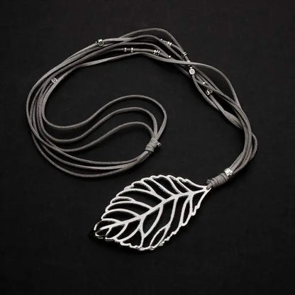 Silver-plated suede necklace featuring a leaf pendant, stylish jewelry piece by Suzie Blue Canada.