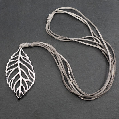Silver-plated suede necklace featuring a leaf pendant, designed by Suzie Blue Canada, showing the pendant against a neutral background.