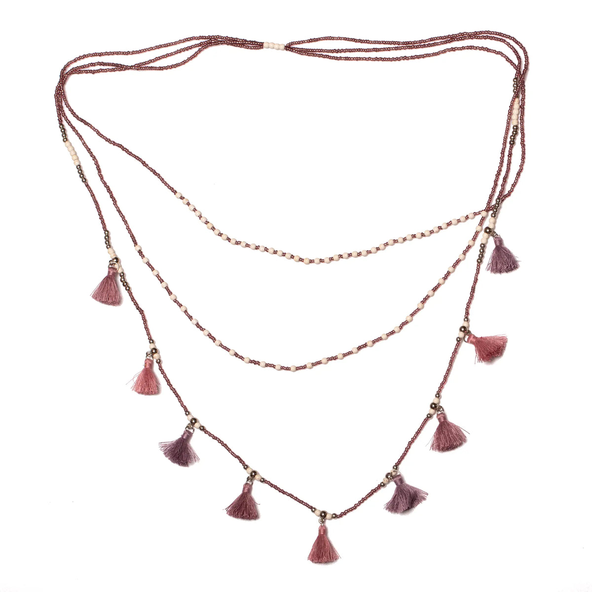 Suzie Blue Canada triple strand tassel necklace with elegant gold-tone chains and hanging tassels, perfect for chic style.