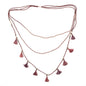 Suzie Blue Canada triple strand tassel necklace with elegant gold-tone chains and hanging tassels, perfect for chic style.