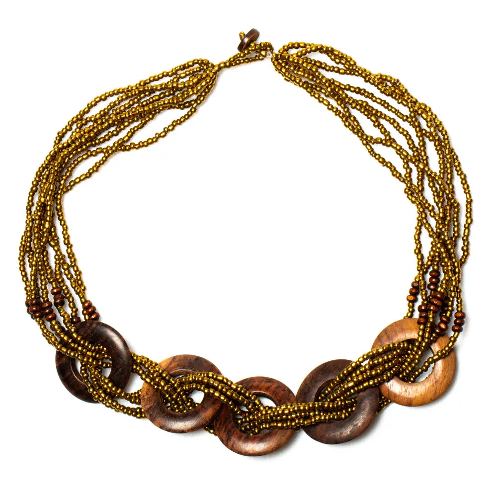 Multi-strand wooden ring necklace by Suzie Blue Canada featuring layered wooden rings on a delicate chain.