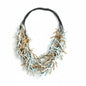 Multi-strand fabric necklace by Suzie Blue Canada featuring colorful, layered fabric strands on a neutral background.