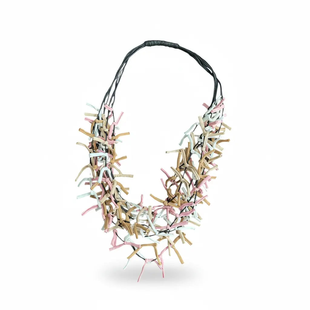 Multi-strand fabric necklace by Suzie Blue Canada featuring colorful, layered fabric strands for a stylish accessory.