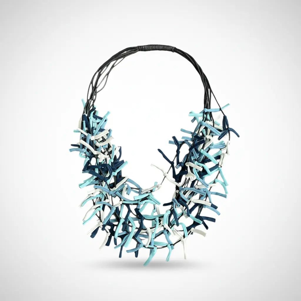 Multi-strand fabric necklace by Suzie Blue Canada featuring colorful woven fabric strands and a stylish design.