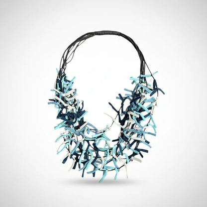 Multi-strand fabric necklace by Suzie Blue Canada featuring colorful woven fabric strands and a stylish design.