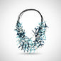 Multi-strand fabric necklace by Suzie Blue Canada featuring colorful woven fabric strands and a stylish design.