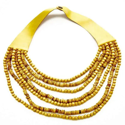 Multi-strand wooden bead necklace by Suzie Blue Canada featuring natural wooden beads and layered design.